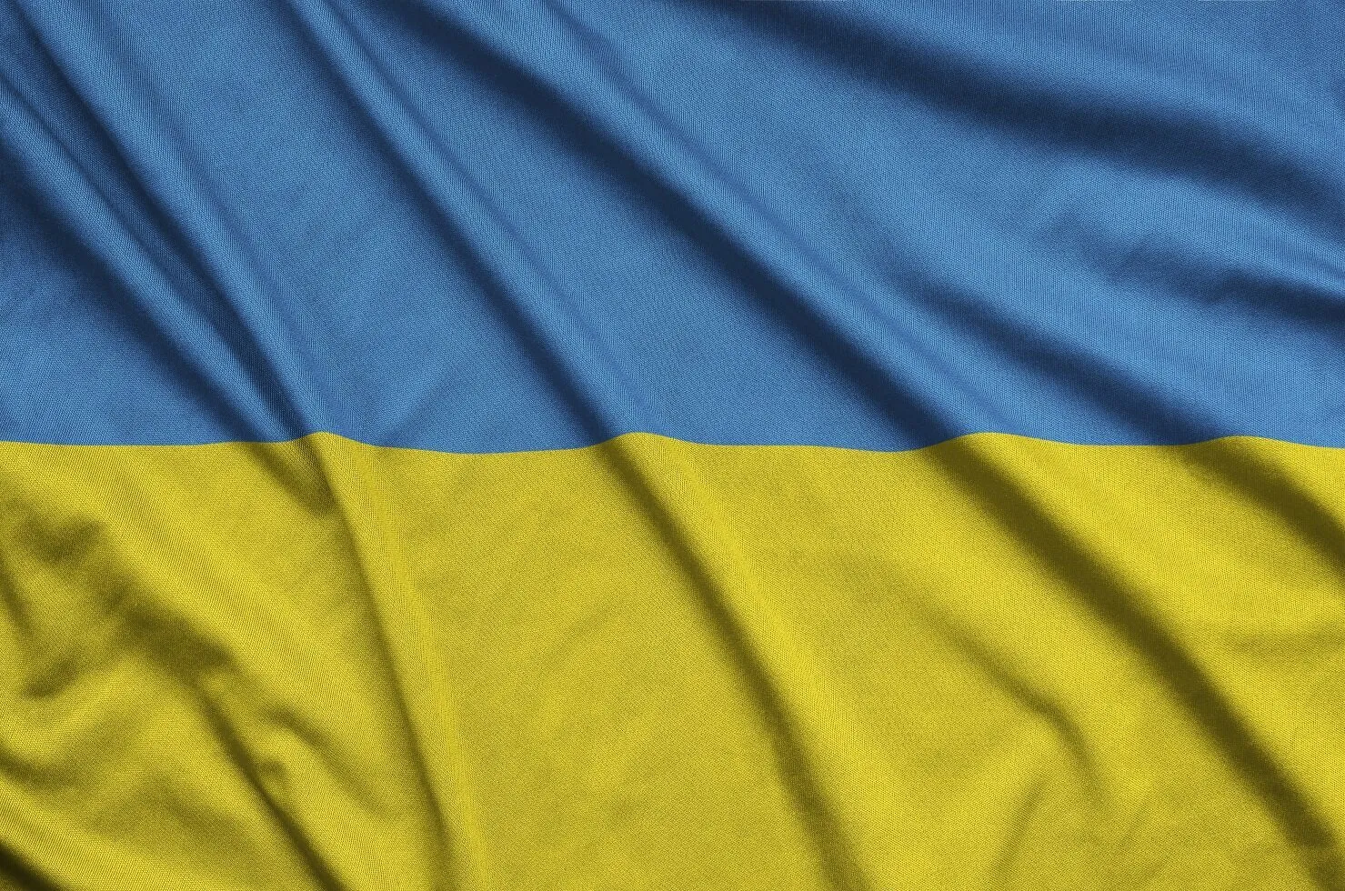 ukraine flag is depicted on a sports cloth fabric KZ3HURJ Михаил Подоляк Михаил Подоляк