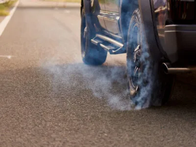 20,727 Vehicle Emission Violations Recorded Across Four Georgian Cities in Three Years 2 close up of a car wheel in smoke on the highway 2022 01 31 05 12 15 utc News