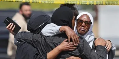 Members of the Muslim community in San Diego react after shooting at their mosque on 18 May 2026