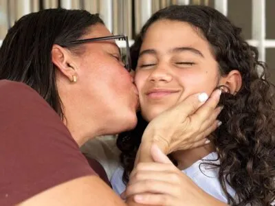 Karina (left) kisses her daughter Fabiana.