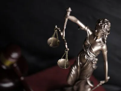 scales of justice with gavel on dark background 2026 09 24 07 04 56 utc Минанда Товстик Минанда Товстик